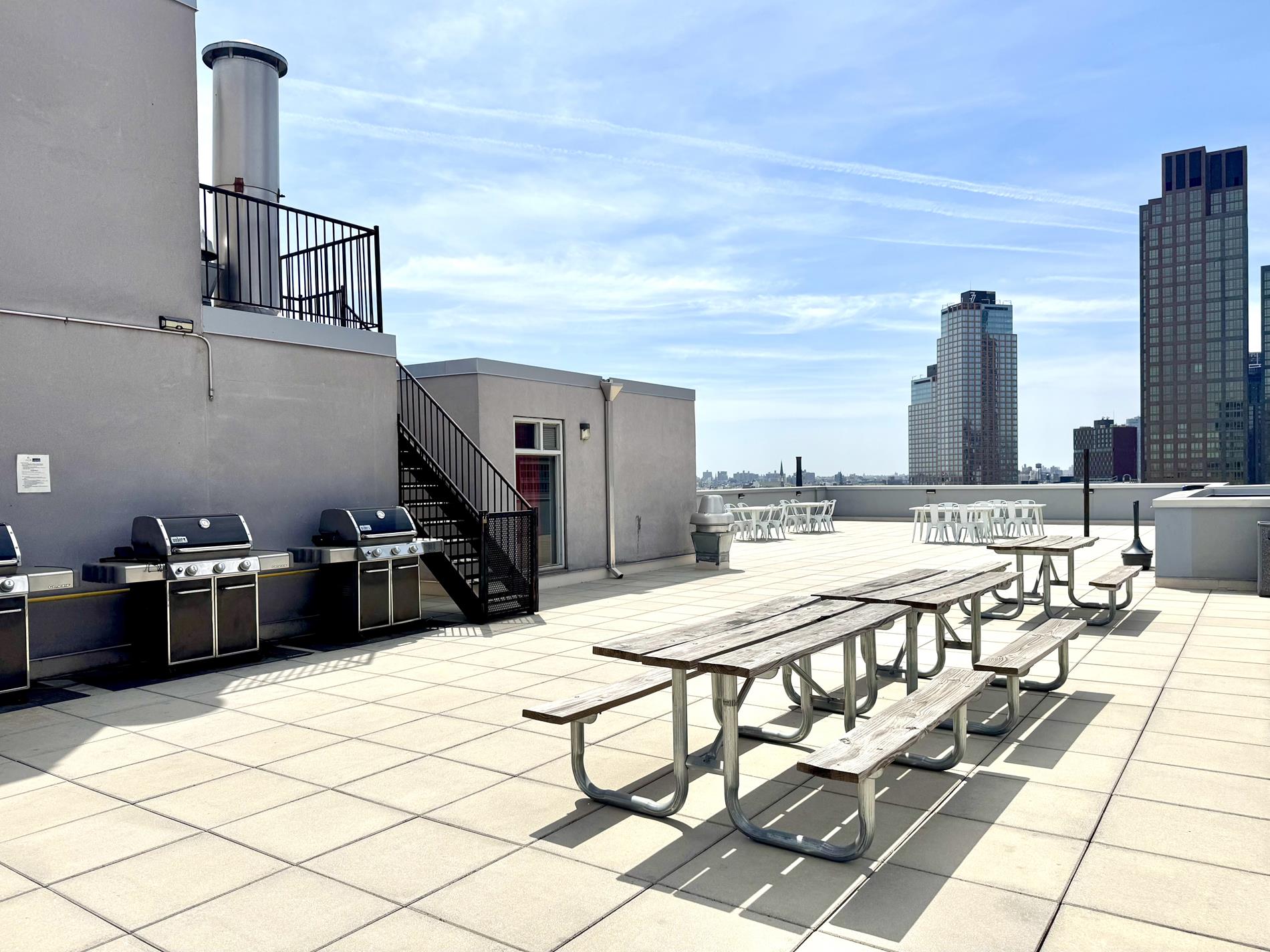 2-26 50th Avenue, Unit 11B Queens, NY 11101 - Photo 11 of 12 a view of dinning table and chairs in the patio