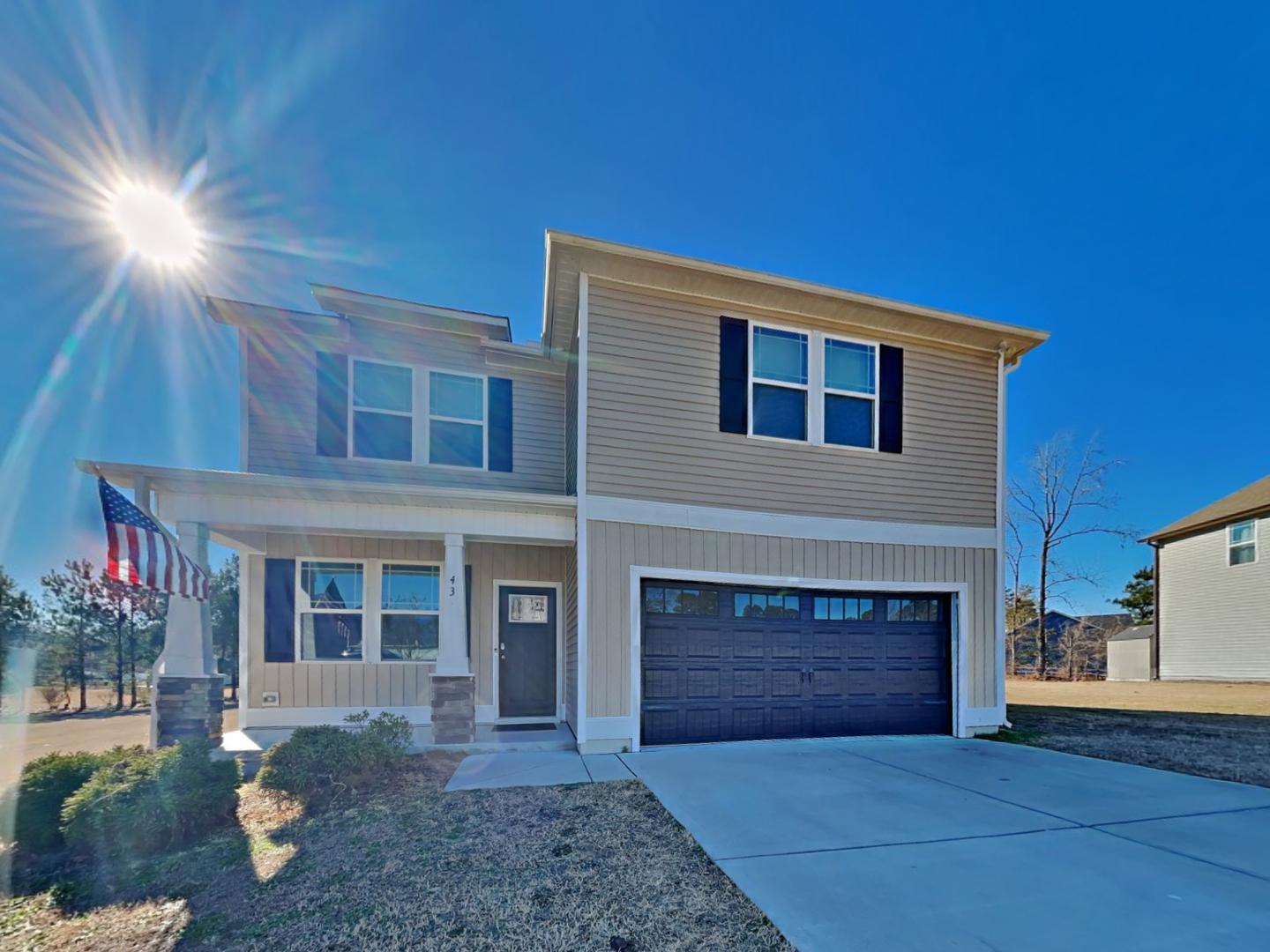 43 Wild Sage Circle Angier, NC 27501 - Photo 1 of 19 a front view of a house with a yard