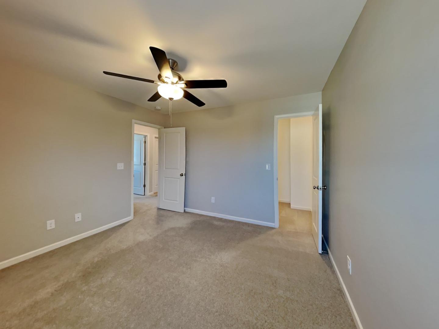43 Wild Sage Circle Angier, NC 27501 - Photo 16 of 19 a view of an empty room and chandelier fan