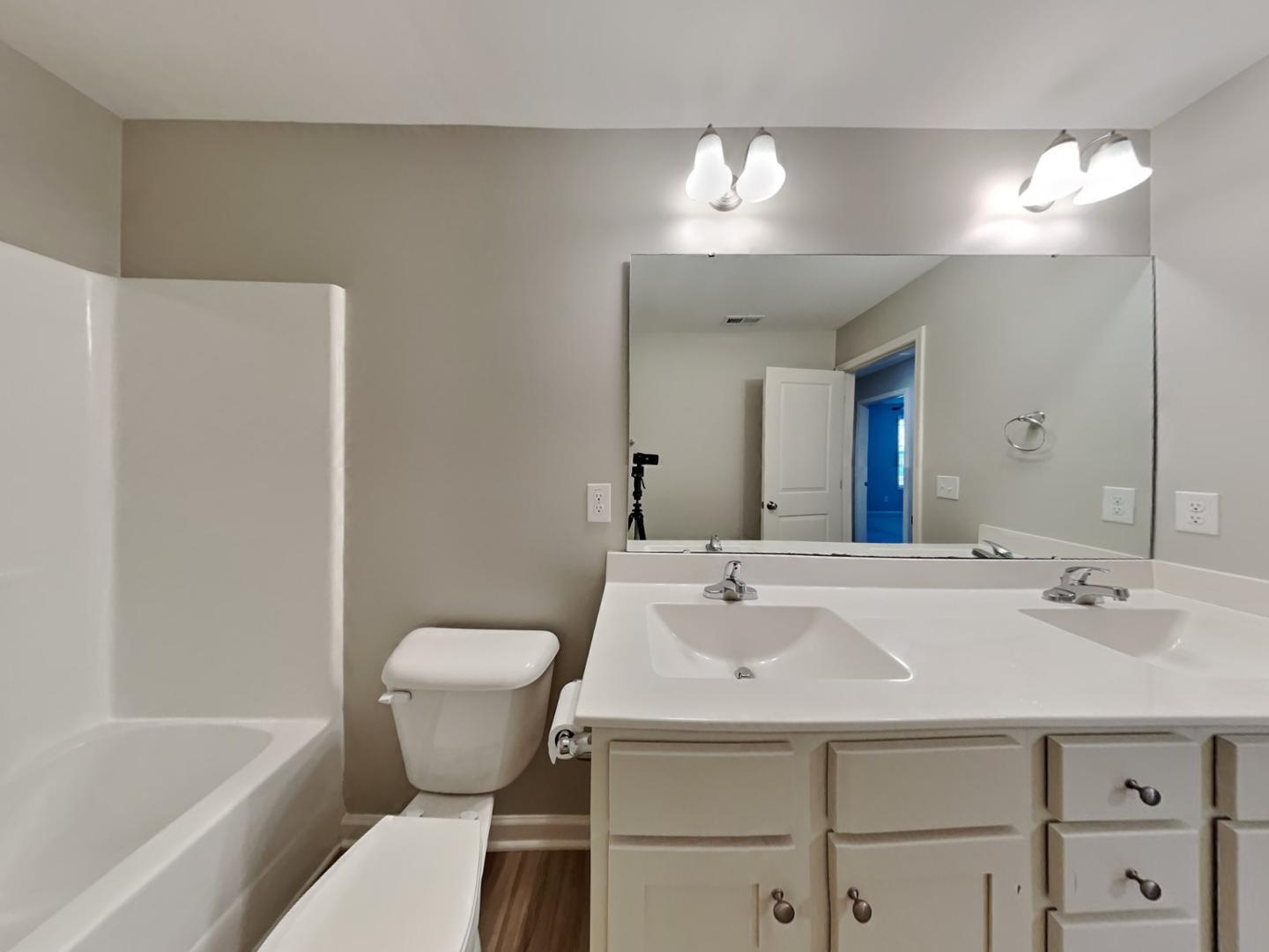 43 Wild Sage Circle Angier, NC 27501 - Photo 17 of 19 a bathroom with a sink toilet and a bathtub