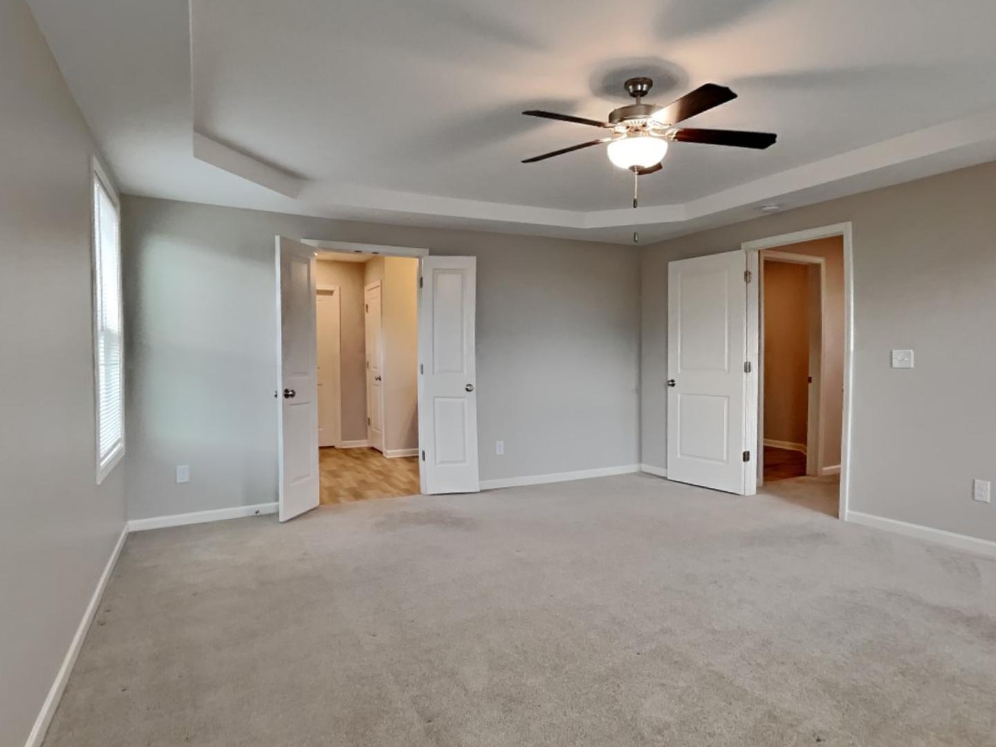43 Wild Sage Circle Angier, NC 27501 - Photo 7 of 19 a view of an empty room with a ceiling fan