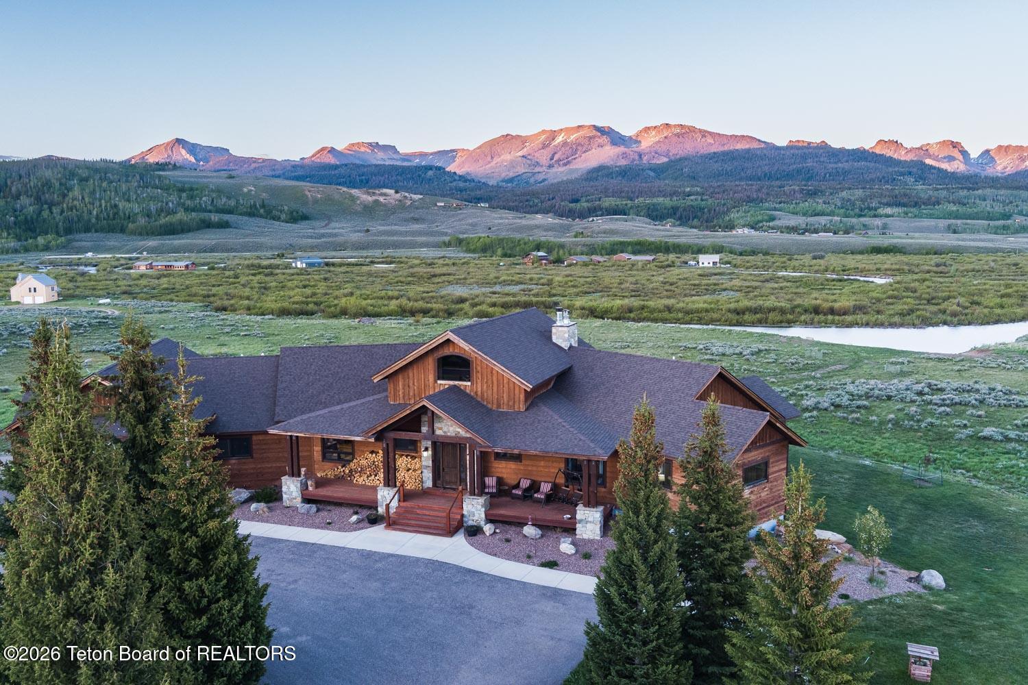 29 White Point Road Cora, WY 82925 - Photo 102 of 102 Home and mountains at sunset