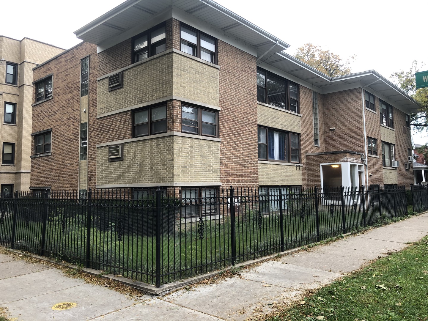2000 West Arthur Avenue, Unit 2NW Chicago, IL 60645 - Photo 1 of 26 a front view of a house with iron fence