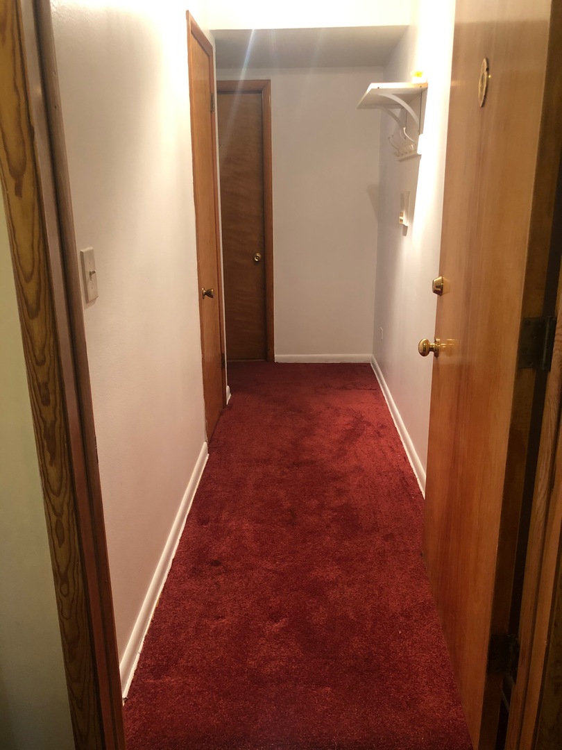 2000 West Arthur Avenue, Unit 2NW Chicago, IL 60645 - Photo 16 of 26 a view of a hallway with wooden floor