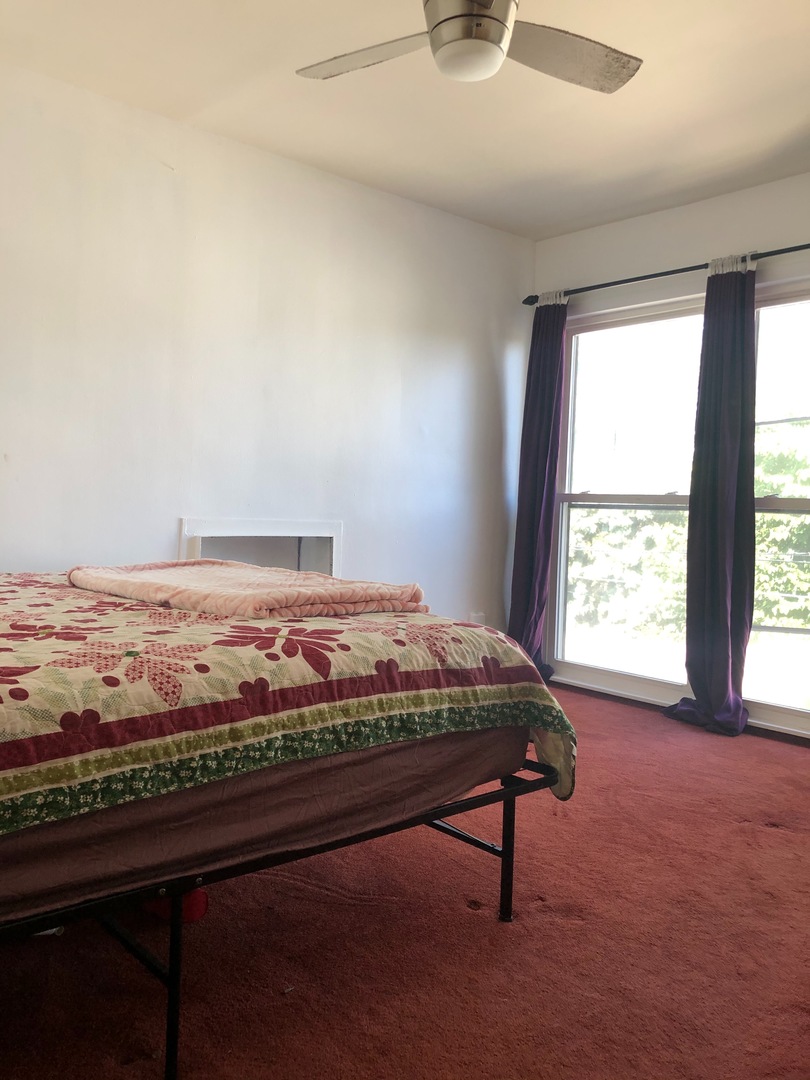 2000 West Arthur Avenue, Unit 2NW Chicago, IL 60645 - Photo 20 of 26 a bedroom with a bed and window