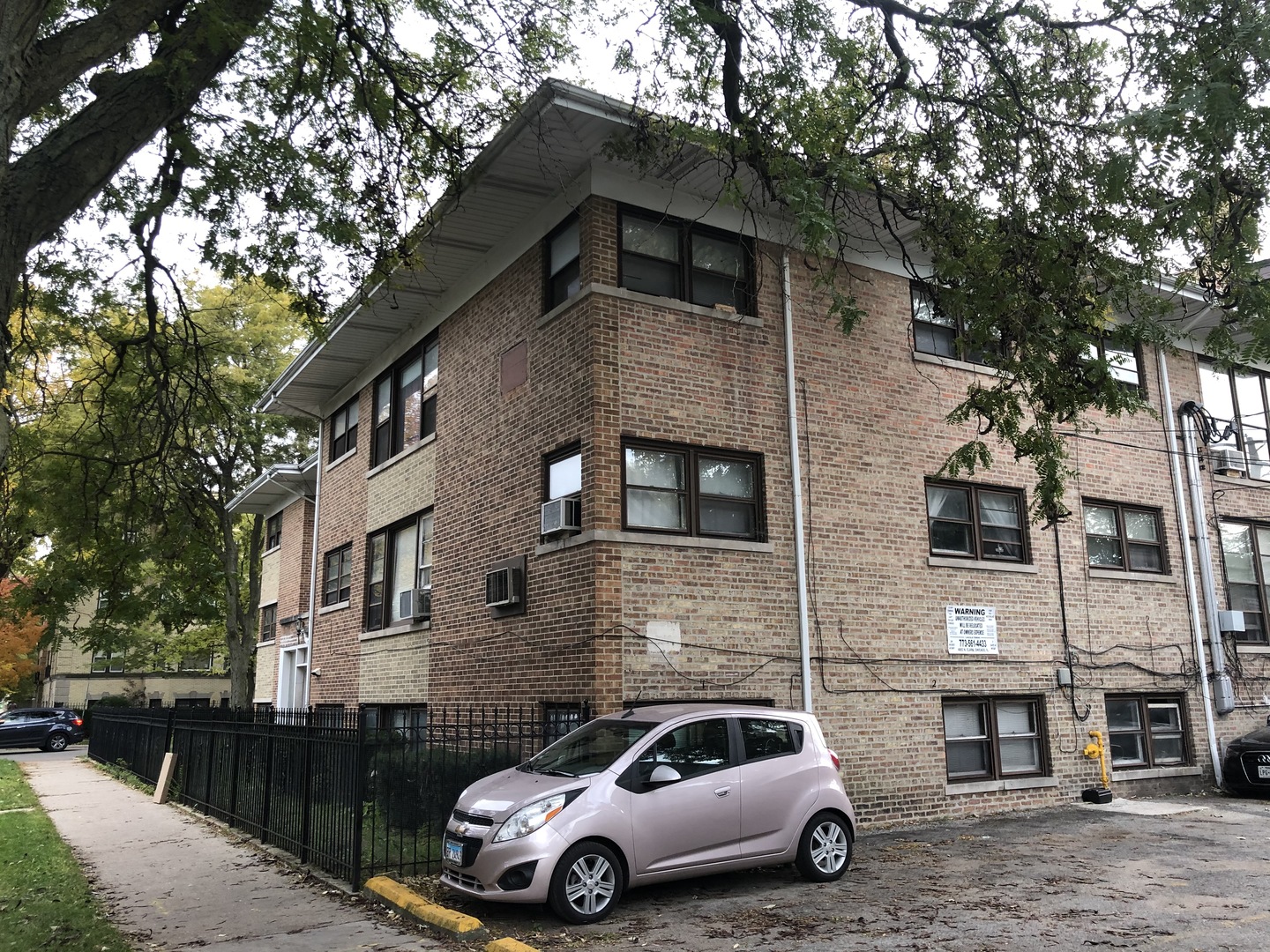 2000 West Arthur Avenue, Unit 2NW Chicago, IL 60645 - Photo 3 of 26 a car parked in front of a building