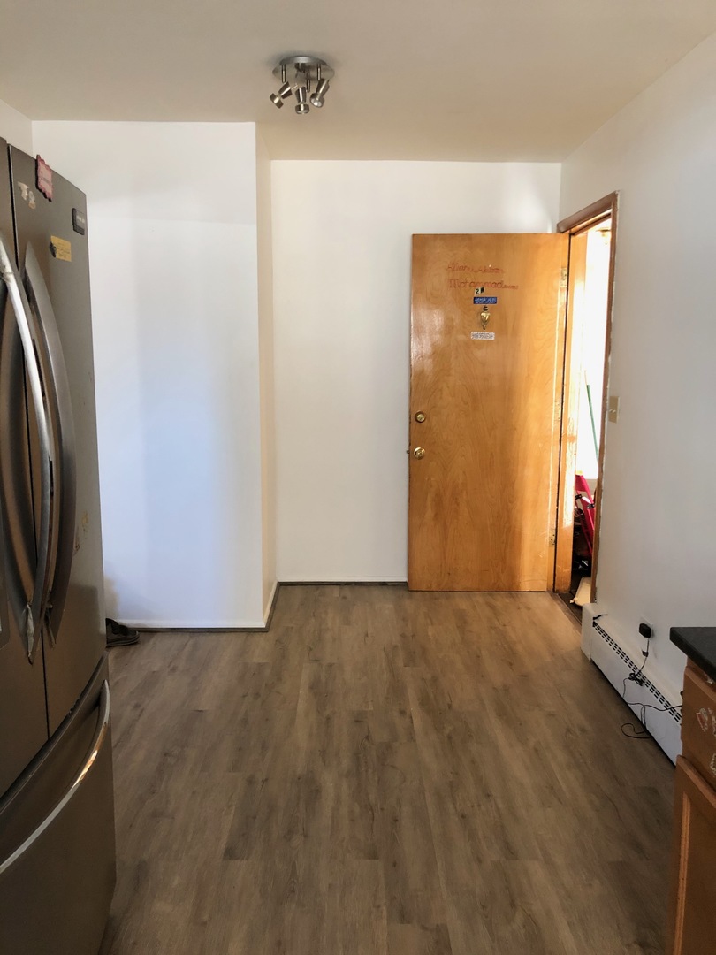 2000 West Arthur Avenue, Unit 2NW Chicago, IL 60645 - Photo 4 of 26 a view of an empty room with a window