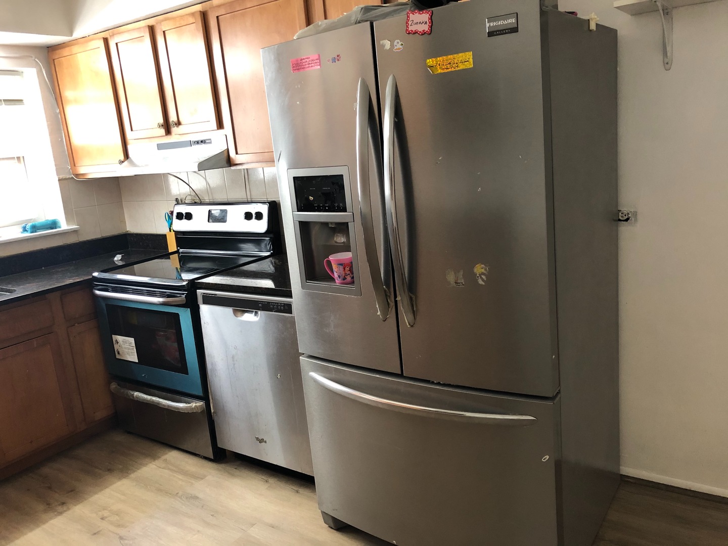 2000 West Arthur Avenue, Unit 2NW Chicago, IL 60645 - Photo 6 of 26 a metallic refrigerator freezer sitting in a kitchen
