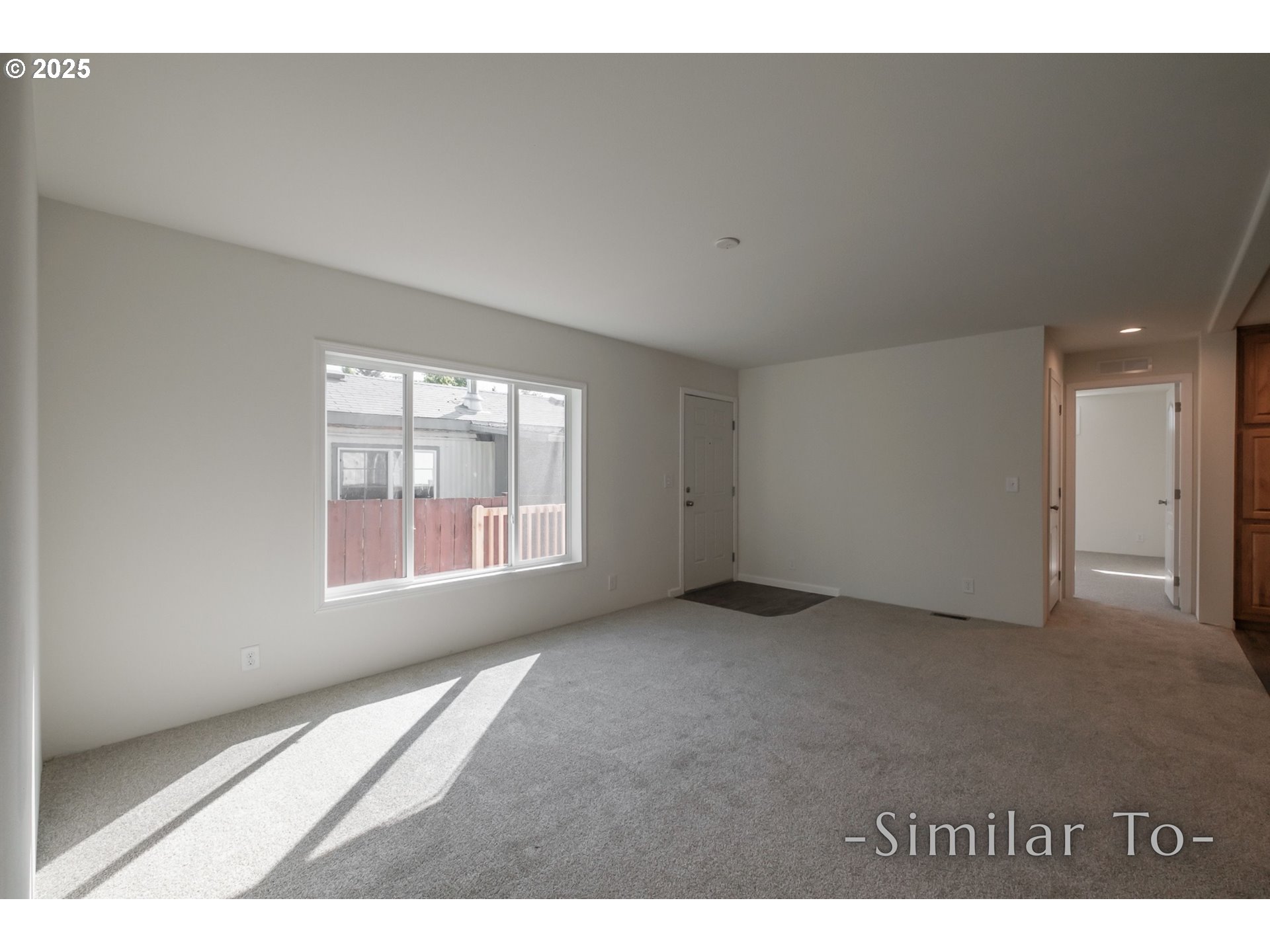 3223 Comber Court Northeast Salem, OR 97305 - Photo 4 of 39 a view of an empty room with a window