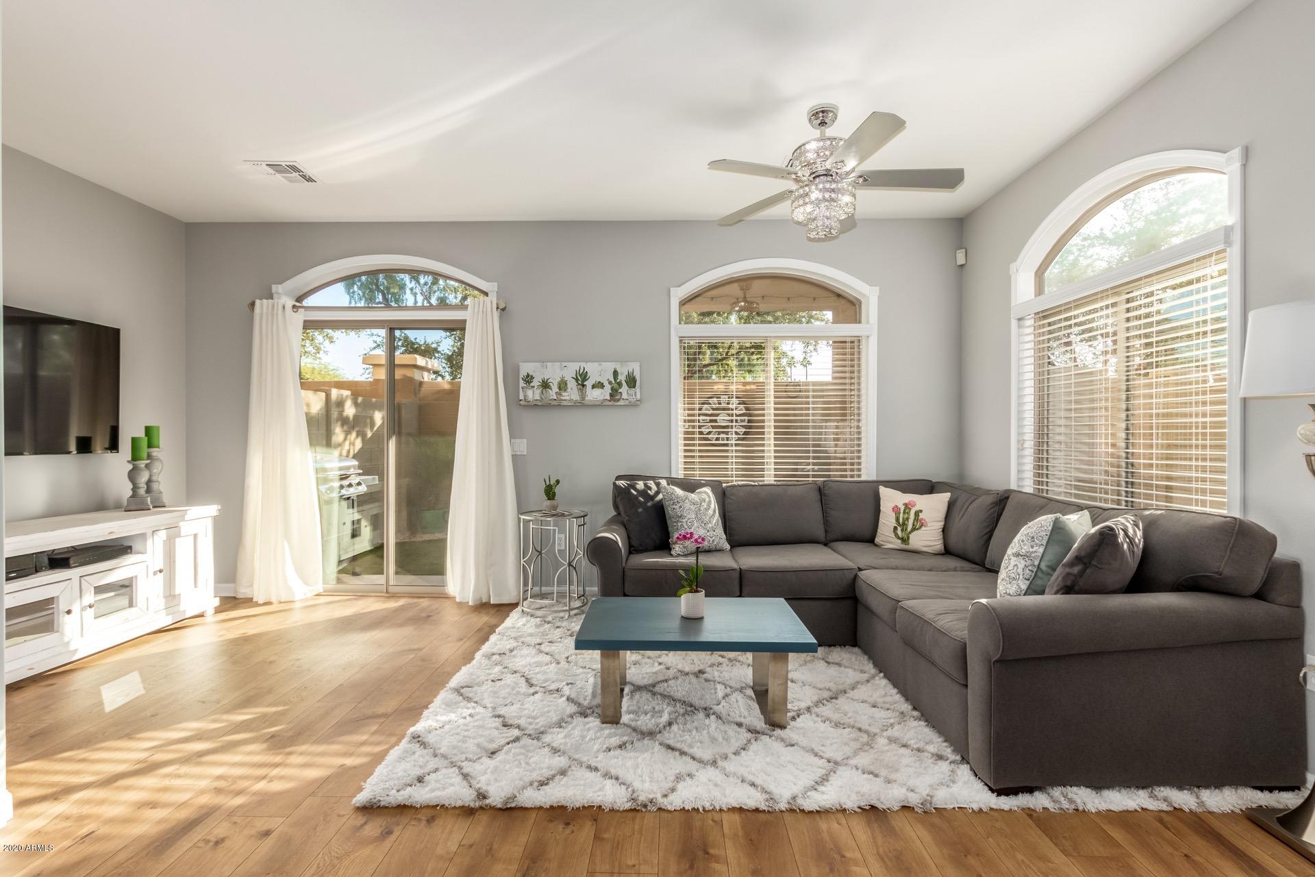 280 South Evergreen Road, Unit 1245 Tempe, AZ 85288 - Photo 3 of 28 a living room with furniture and a large window