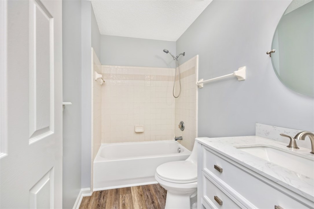 96438 Chester Road Yulee, FL 32097 - Photo 16 of 25 a bathroom with a granite countertop sink toilet and shower