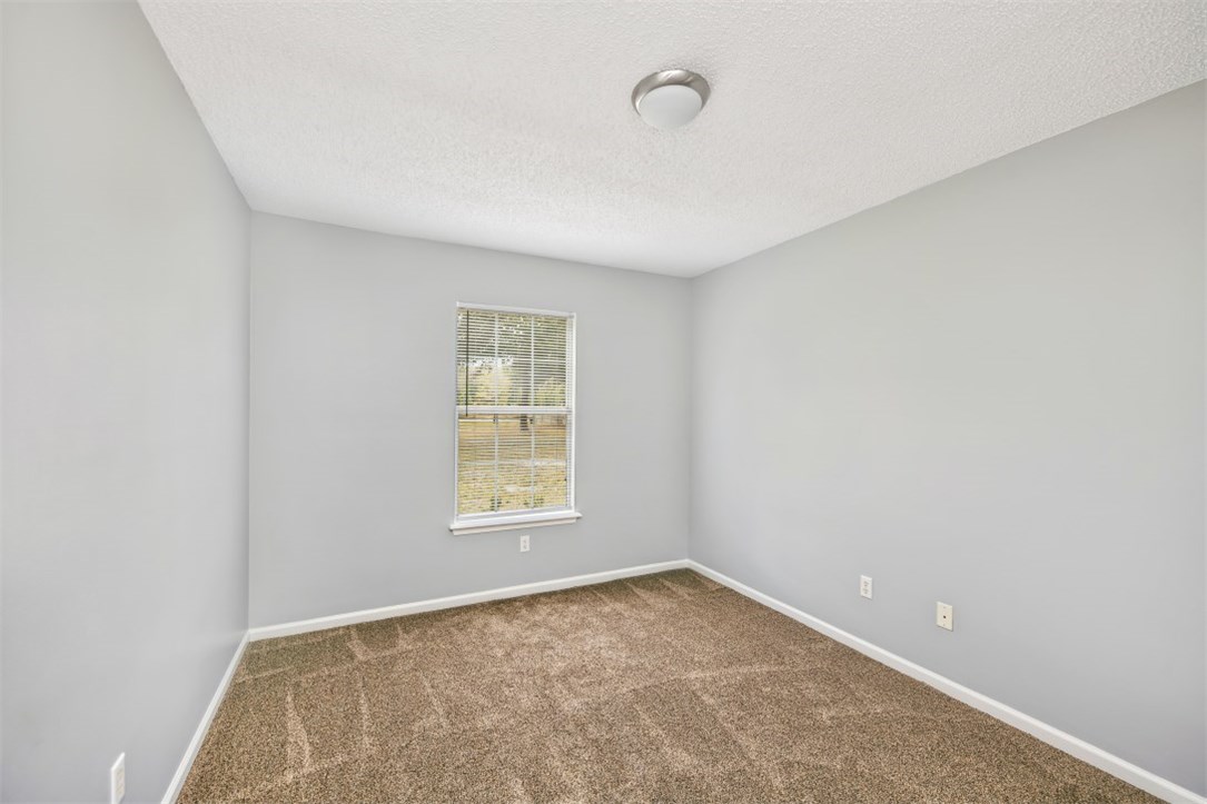 96438 Chester Road Yulee, FL 32097 - Photo 20 of 25 an empty room with a window