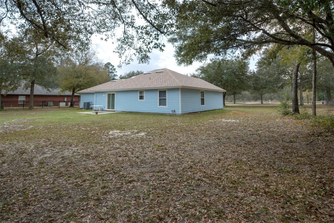 96438 Chester Road Yulee, FL 32097 - Photo 24 of 25 a house with trees in the background