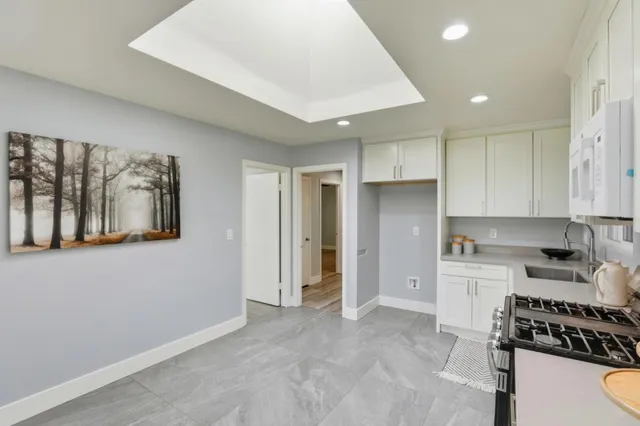 a kitchen with a sink and a window