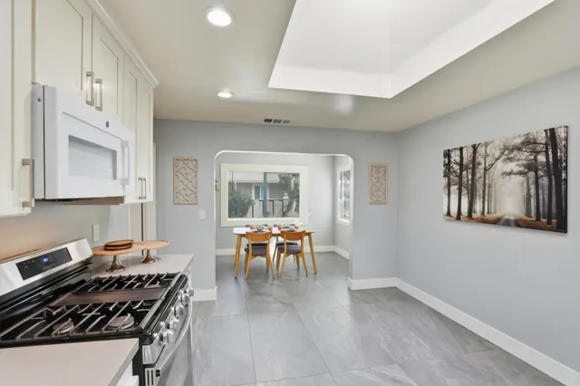 a dining room with furniture and wooden floor