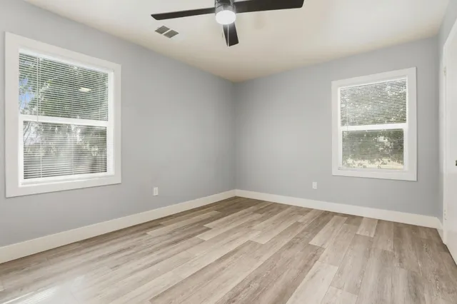 a view of a room with wooden walls