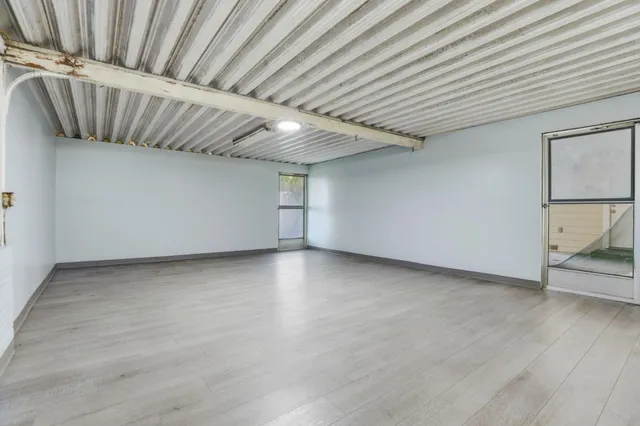 a view of a house with a yard and garage