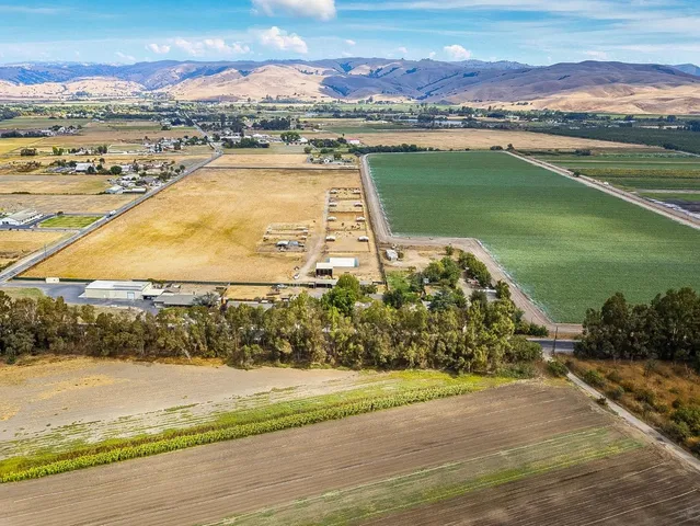 an aerial view of a house with a lake view