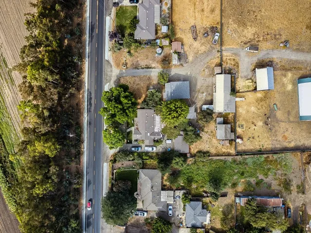 an aerial view of residential building and lake