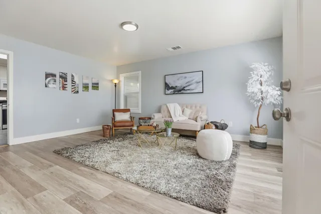 a living room with furniture and a window