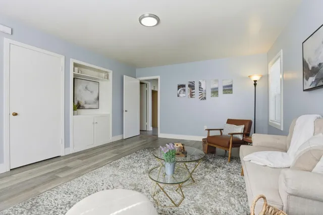 a living room with furniture and window