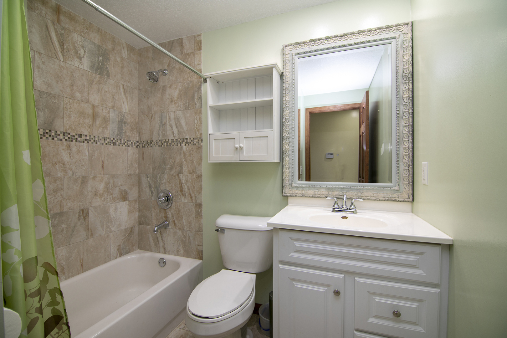 1173 Cecil Drive Kankakee, IL 60901 - Photo 13 of 32 a bathroom with a sink toilet and shower