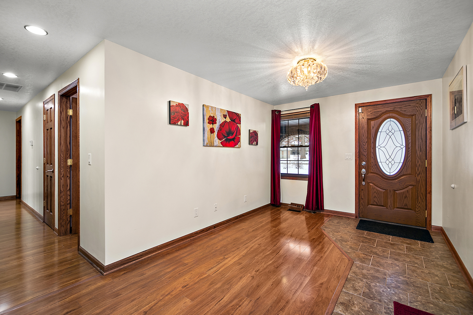 1173 Cecil Drive Kankakee, IL 60901 - Photo 2 of 32 a view of a hallway with wooden floor