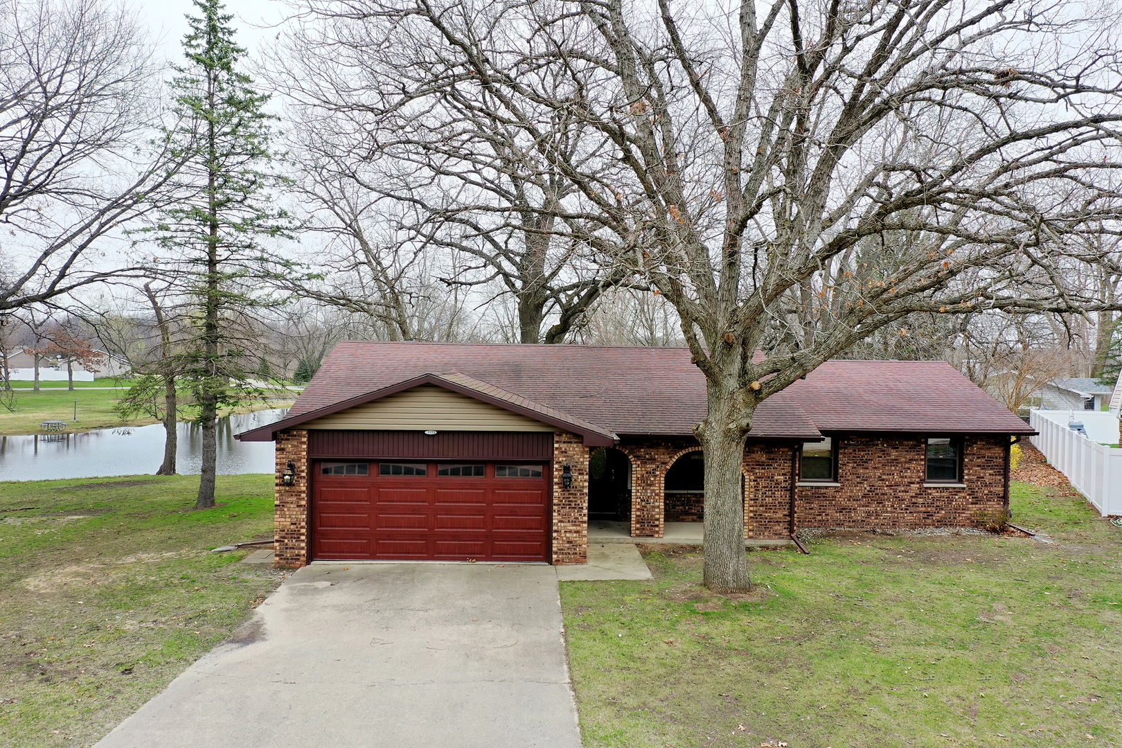 1173 Cecil Drive Kankakee, IL 60901 - Photo 22 of 32 a front view of a house with garden