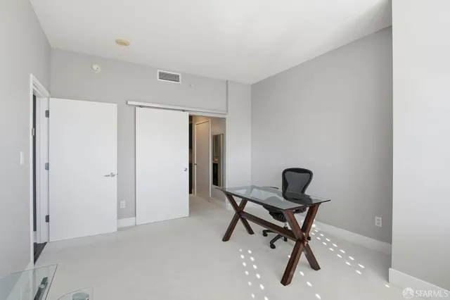 a view of a workspace with furniture