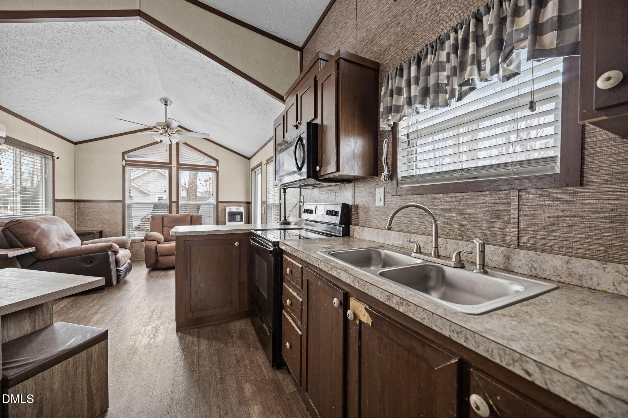 157 Red Wing Drive Louisburg, NC 27549 - Photo 11 of 25 a kitchen with a sink cabinets and a window