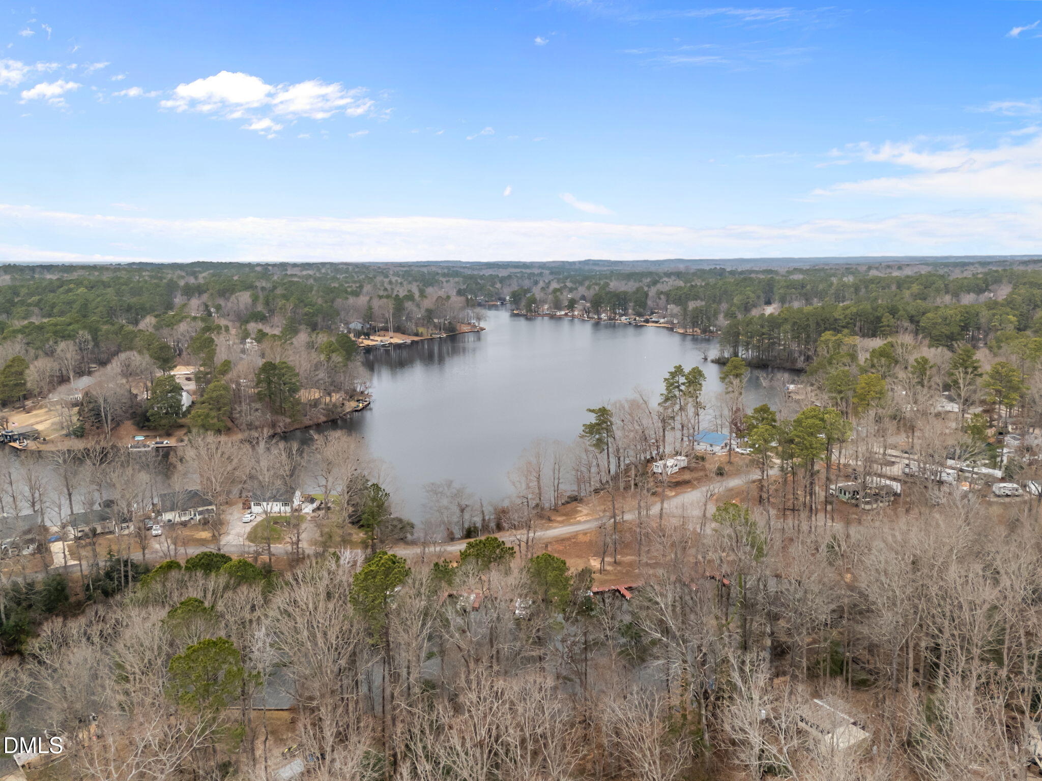 157 Red Wing Drive Louisburg, NC 27549 - Photo 22 of 25 a view of a lake with a city