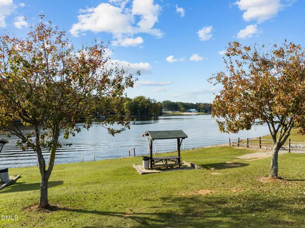 a view of a lake in front of residential houses