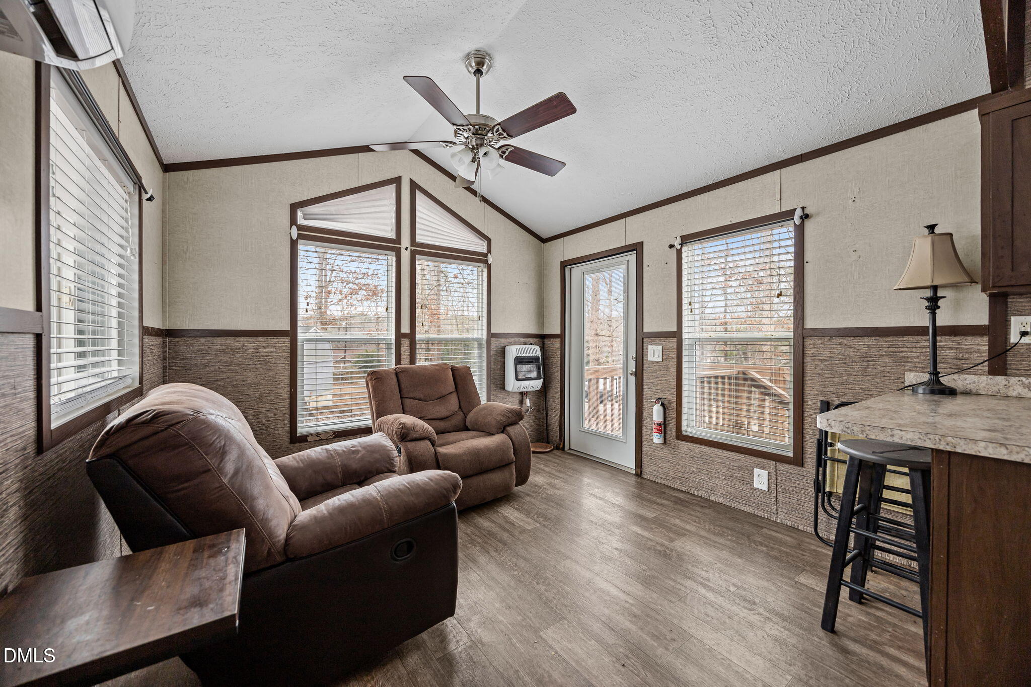 157 Red Wing Drive Louisburg, NC 27549 - Photo 9 of 25 a living room with furniture a ceiling fan and a large window