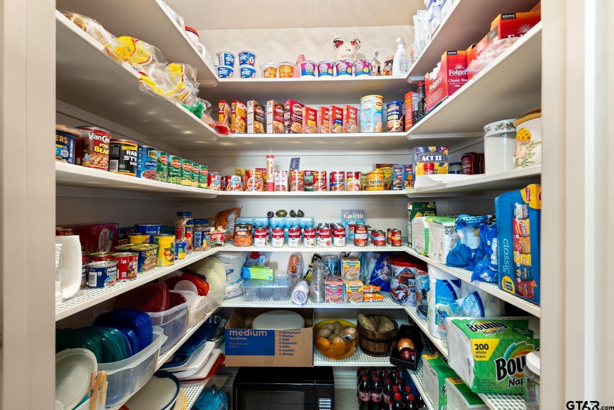 4 County Road 3566 Dike, TX 75437 - Photo 12 of 36 a store room with lots of fruit and a table