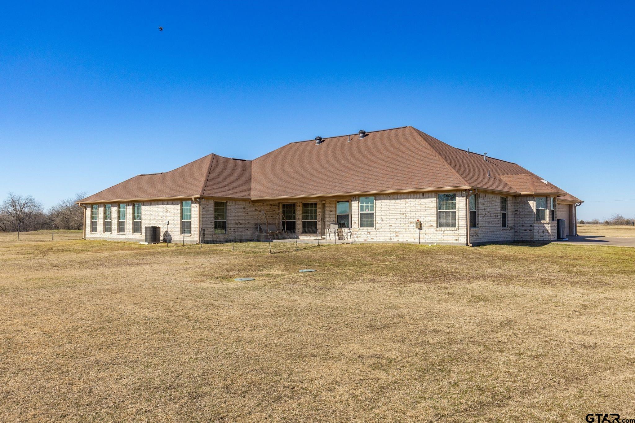 4 County Road 3566 Dike, TX 75437 - Photo 15 of 36 a house with trees in front of it