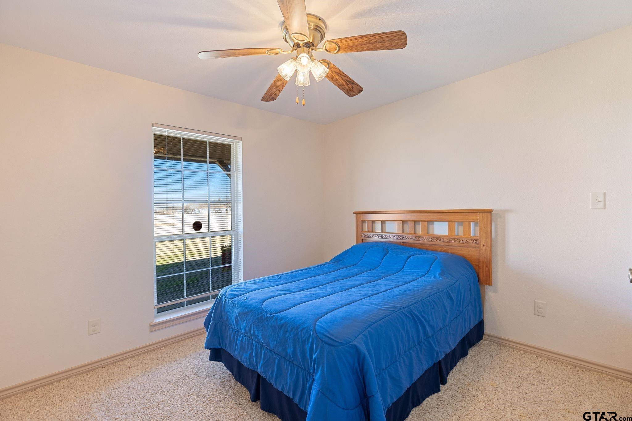 4 County Road 3566 Dike, TX 75437 - Photo 20 of 36 a bedroom with a bed and a closet