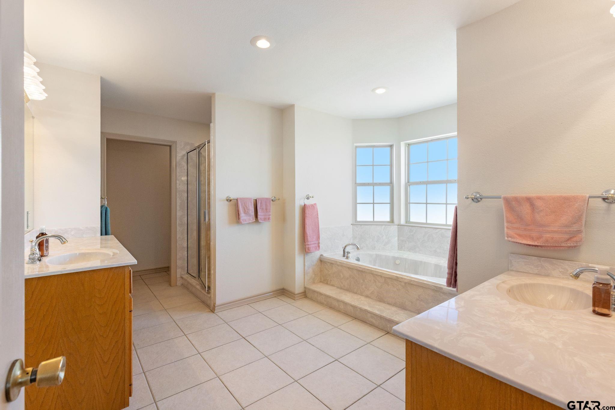 4 County Road 3566 Dike, TX 75437 - Photo 26 of 36 a spacious bathroom with a tub sink and mirror