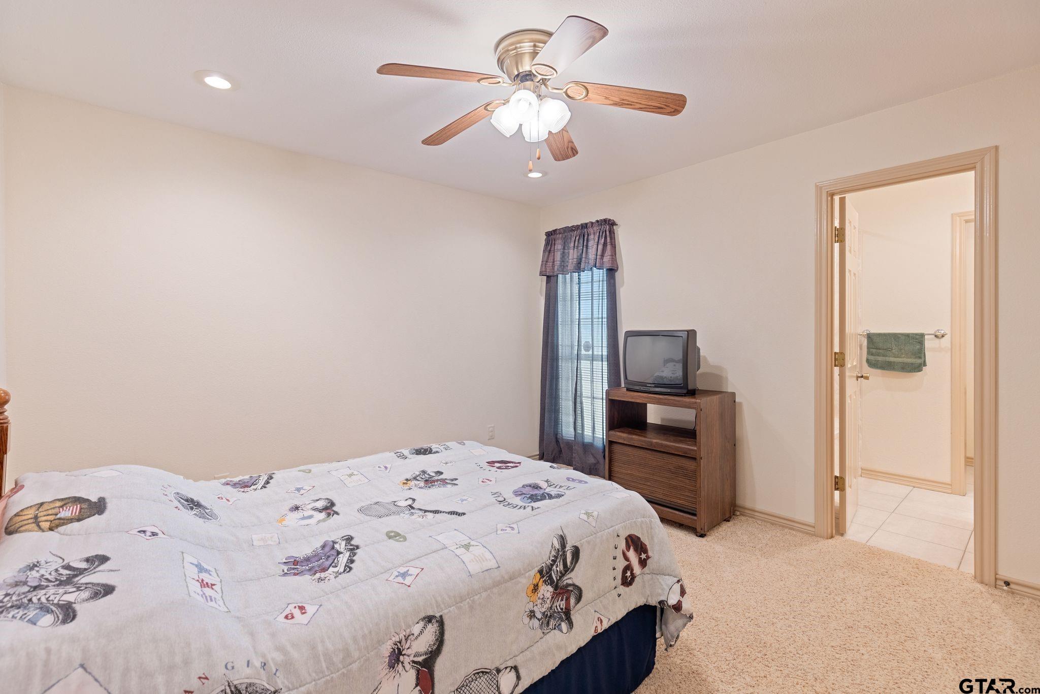 4 County Road 3566 Dike, TX 75437 - Photo 28 of 36 a bedroom with a bed and a flat screen tv