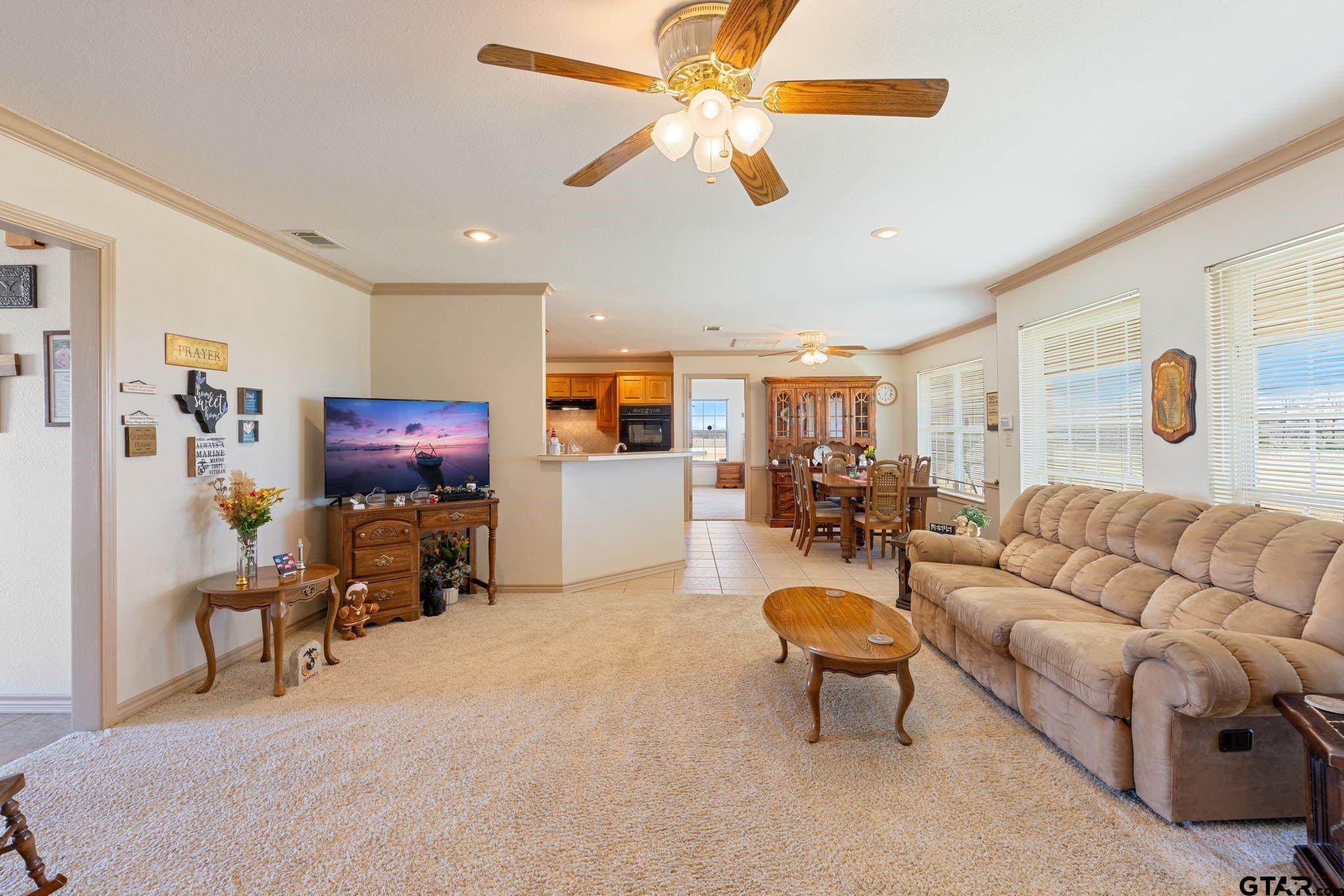 4 County Road 3566 Dike, TX 75437 - Photo 33 of 36 a living room with furniture and a flat screen tv