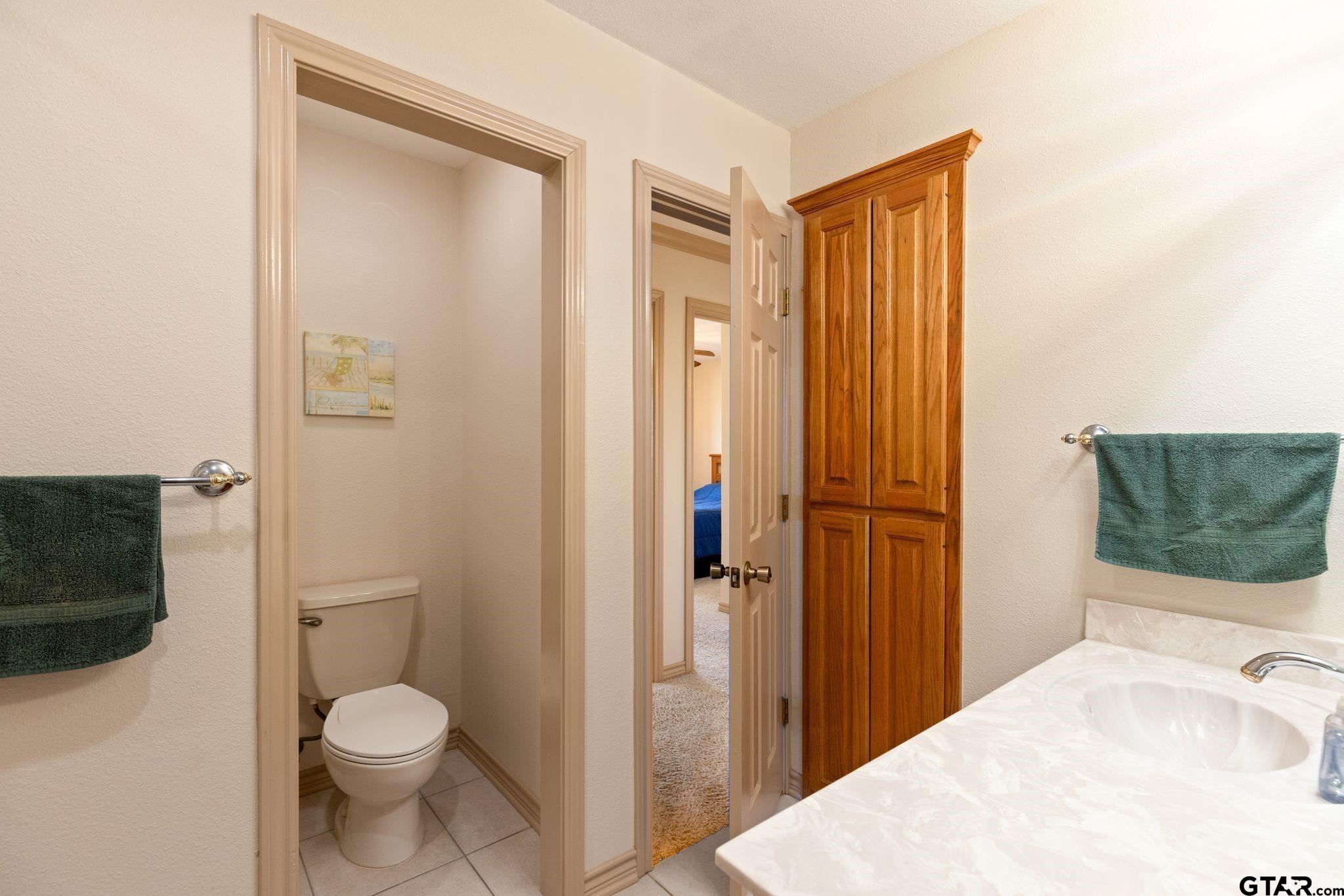 4 County Road 3566 Dike, TX 75437 - Photo 36 of 36 a bathroom with a granite countertop sink toilet and shower