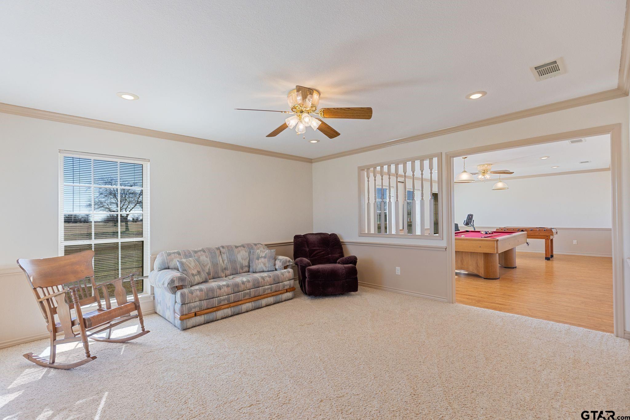 4 County Road 3566 Dike, TX 75437 - Photo 8 of 36 a living room with furniture and a chandelier