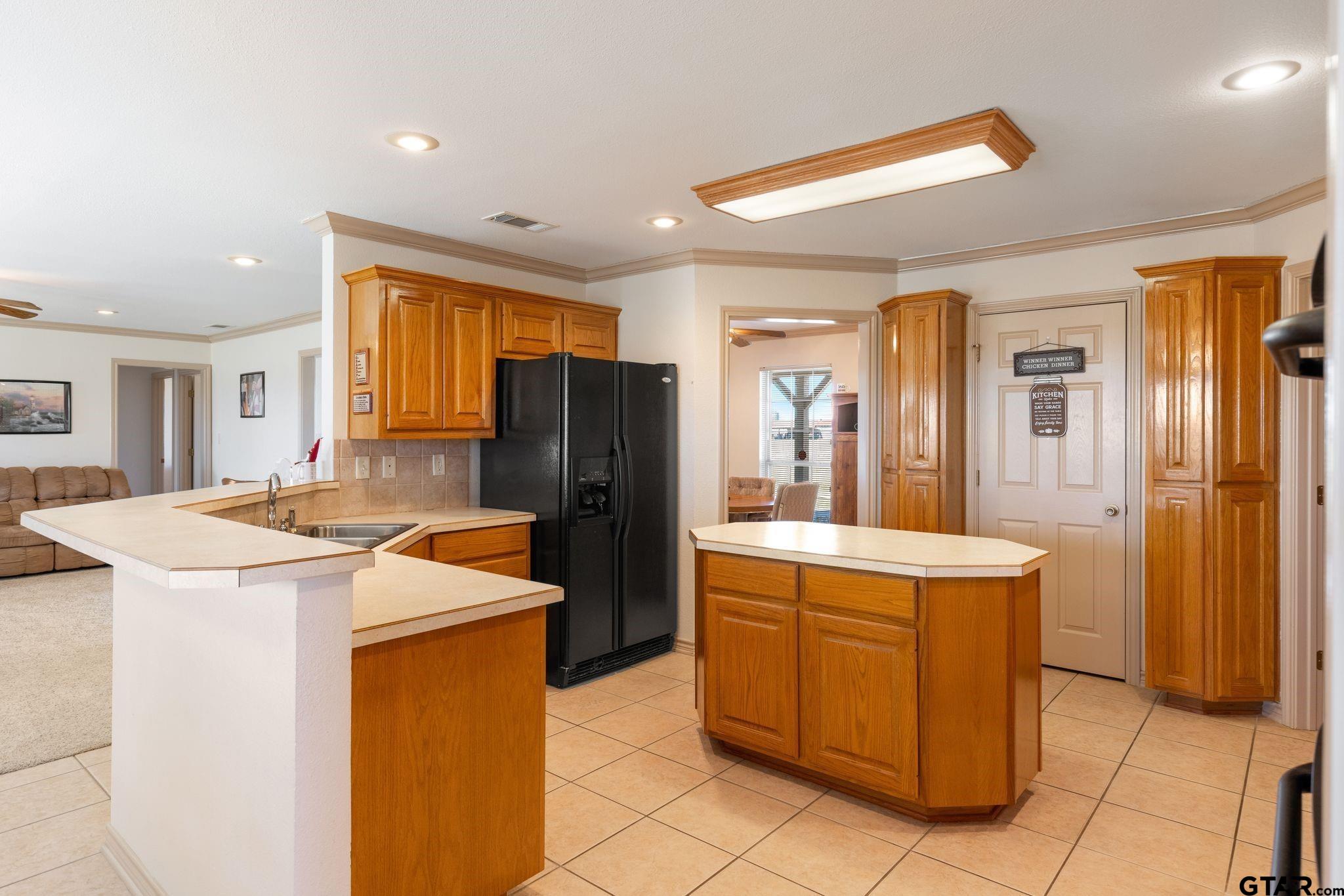 4 County Road 3566 Dike, TX 75437 - Photo 9 of 36 a kitchen that has a cabinets and a refrigerator