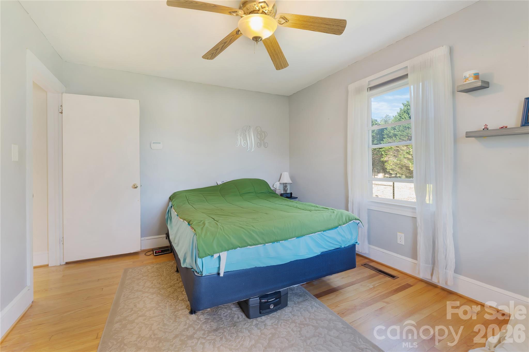 6268 Long Island Road Catawba, NC 28609 - Photo 15 of 38 a bedroom with a bed and a chandelier