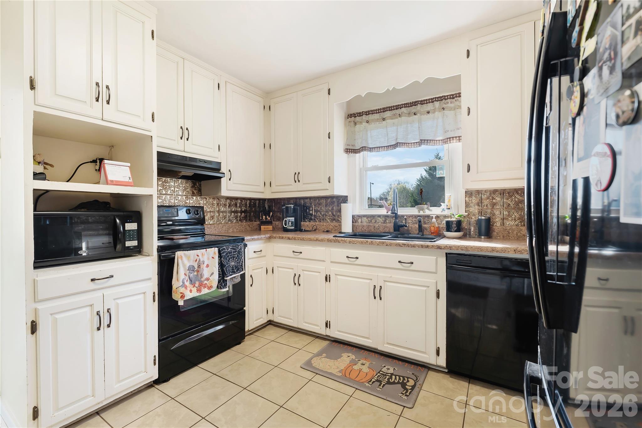 6268 Long Island Road Catawba, NC 28609 - Photo 6 of 38 a kitchen with stainless steel appliances a refrigerator sink and cabinets