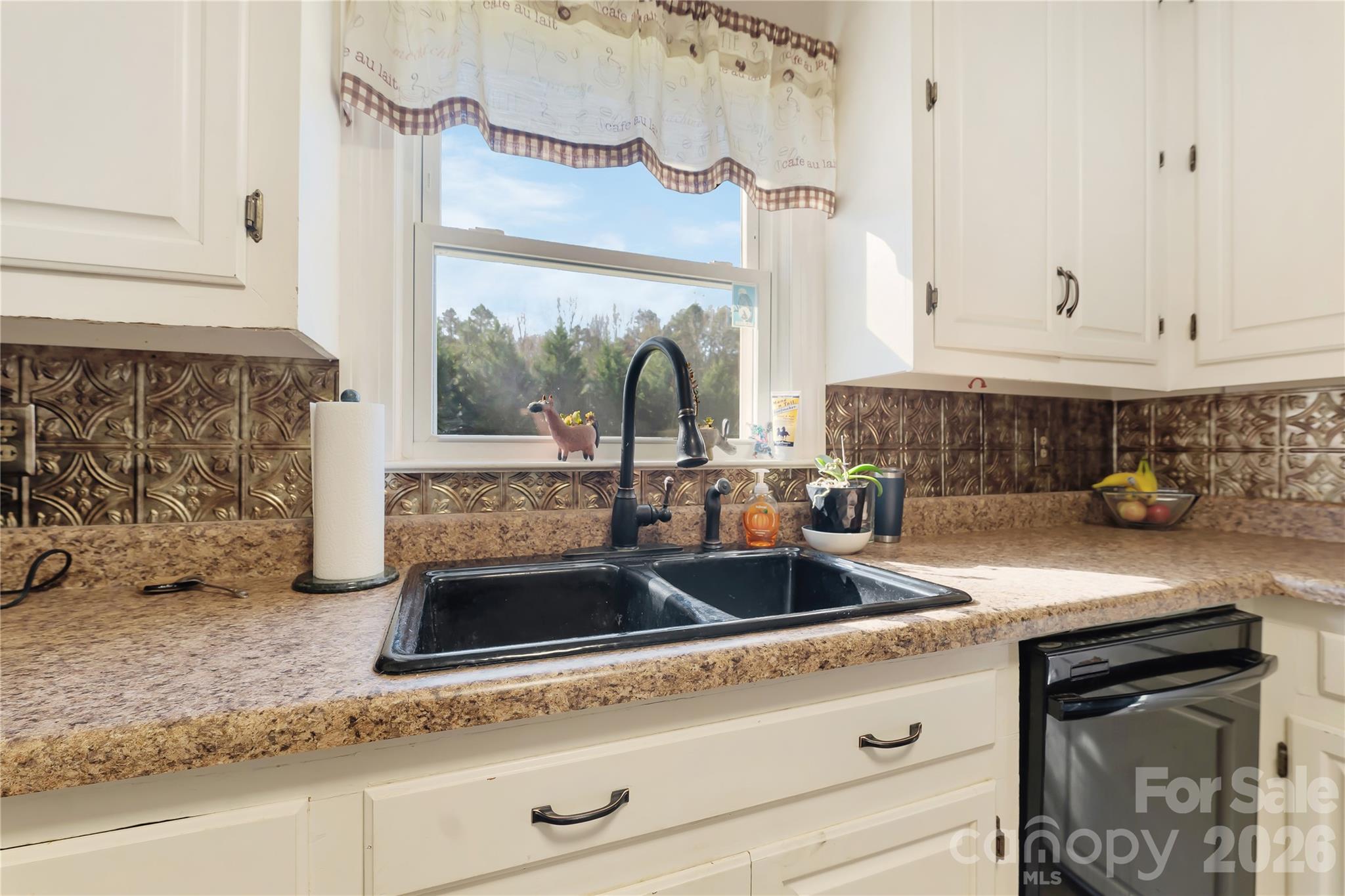 6268 Long Island Road Catawba, NC 28609 - Photo 7 of 38 a kitchen with a sink and a stove with wooden floor