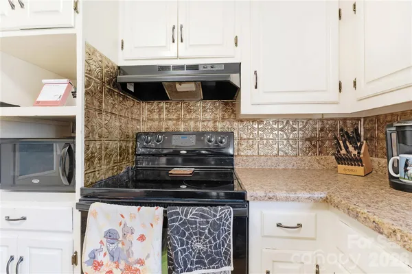a kitchen with a stove and a sink