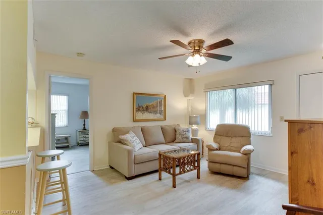 a kitchen with stainless steel appliances a refrigerator sink and microwave