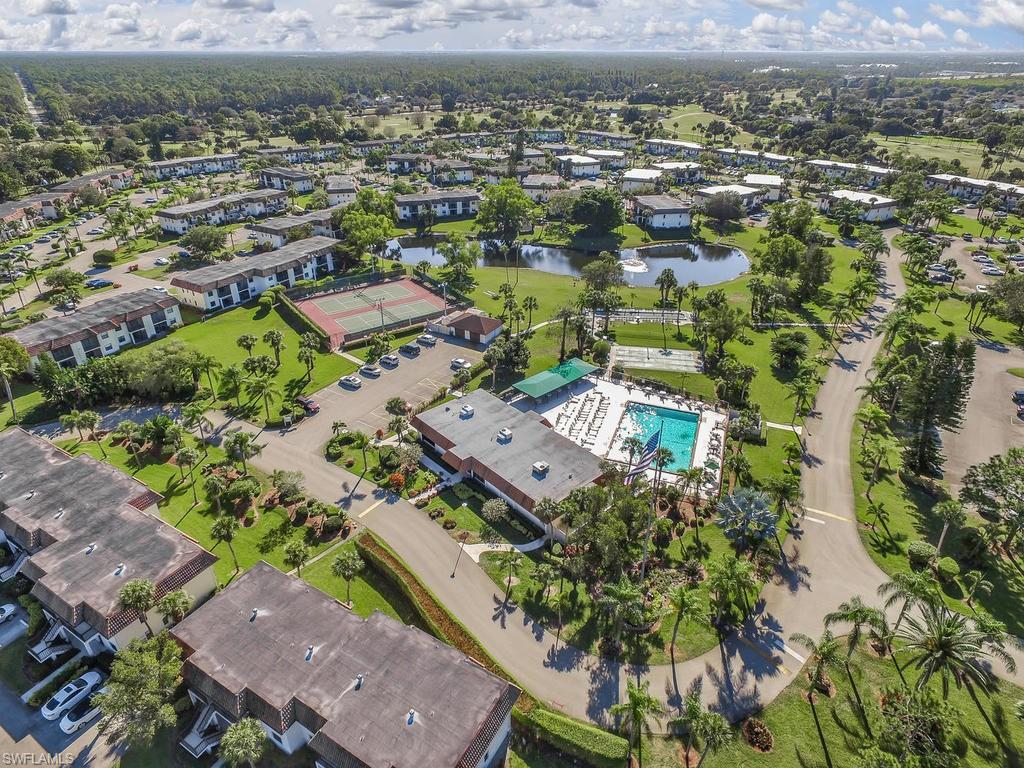 4351 27th Court Southwest, Unit 203 Naples, FL 34116 - Photo 31 of 34 Drone / aerial view with a water view
