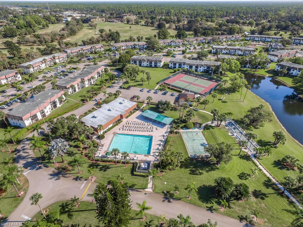 4351 27th Court Southwest, Unit 203 Naples, FL 34116 - Photo 32 of 34 Bird's eye view featuring a water view