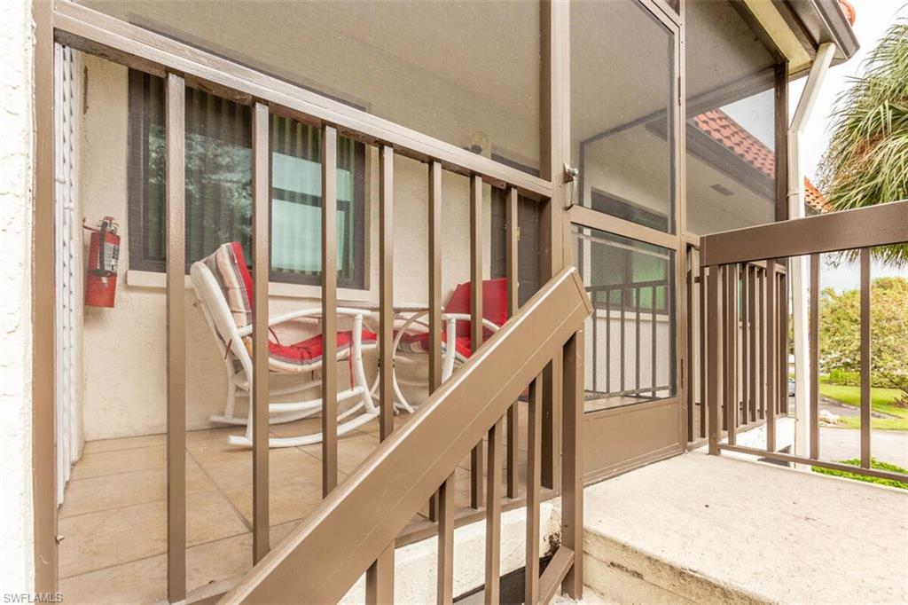 4351 27th Court Southwest, Unit 203 Naples, FL 34116 - Photo 8 of 34 Screened lanai with washer/dryer in closet